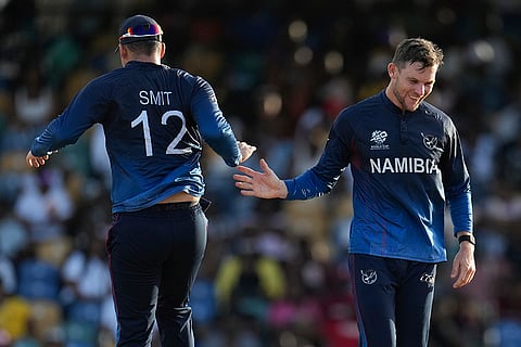 Gerhard Erasmus  celebrates Michael Jones's wicket